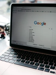 A close-up view of a laptop displaying a search engine page