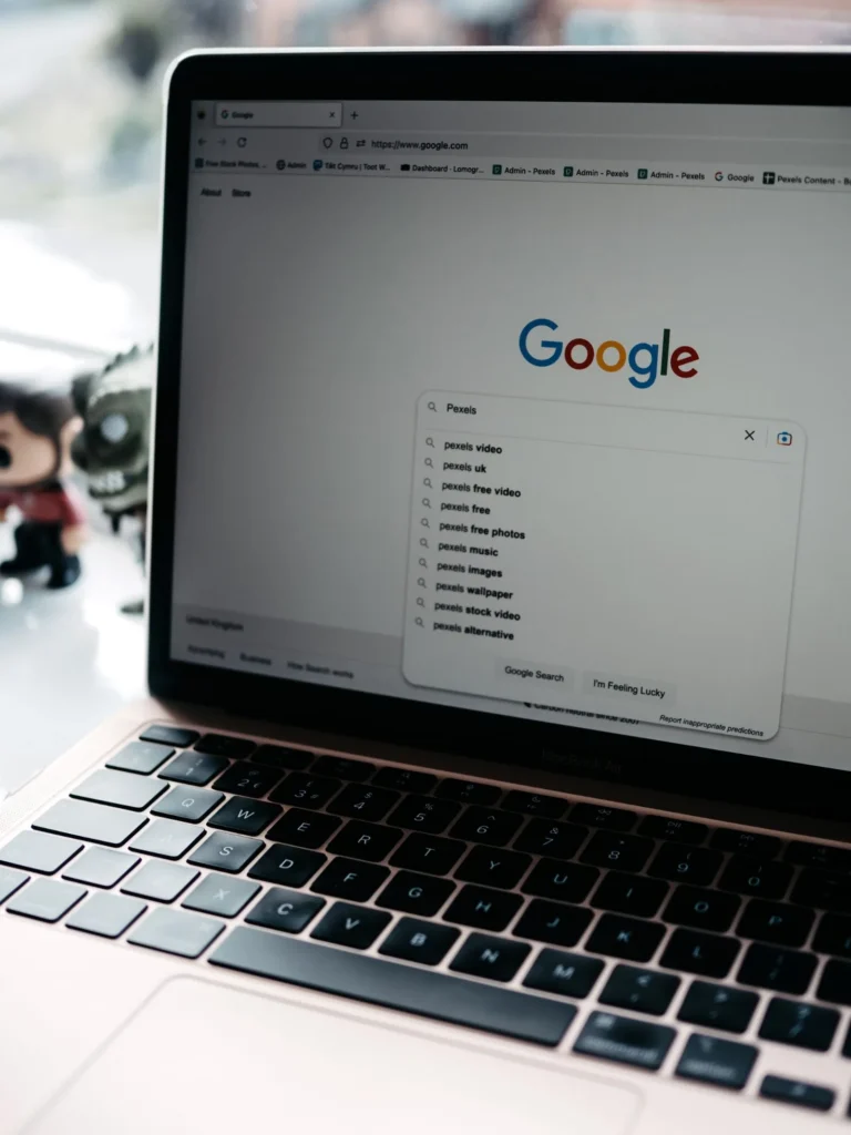 A close-up view of a laptop displaying a search engine page